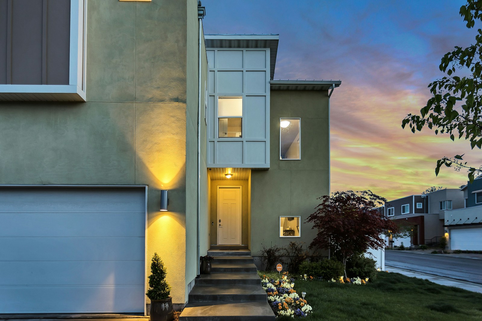 outdoor lamps turned on, house